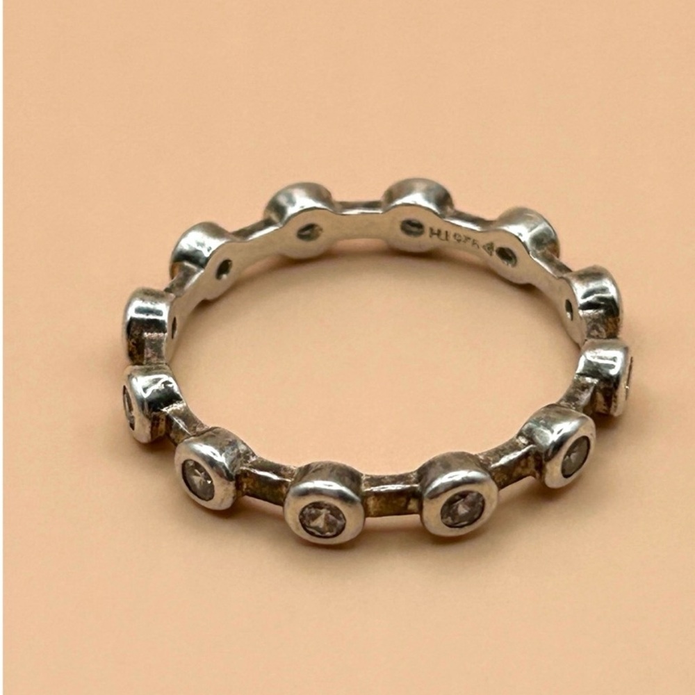 Channel Set 
SILPADA Silver Cubic Zirconia eternity band  R2063 Retired. Size 8